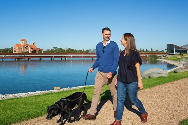 Couple enjoying the grounds and walking the dog Bunurong Memorial Park