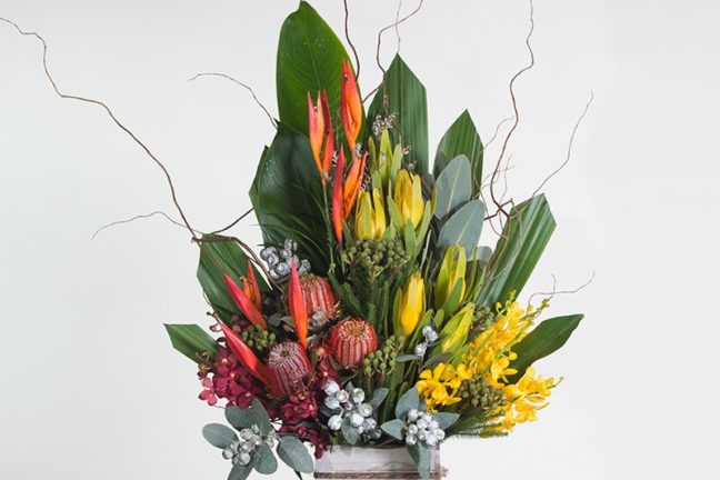 Florist building floral arrangement