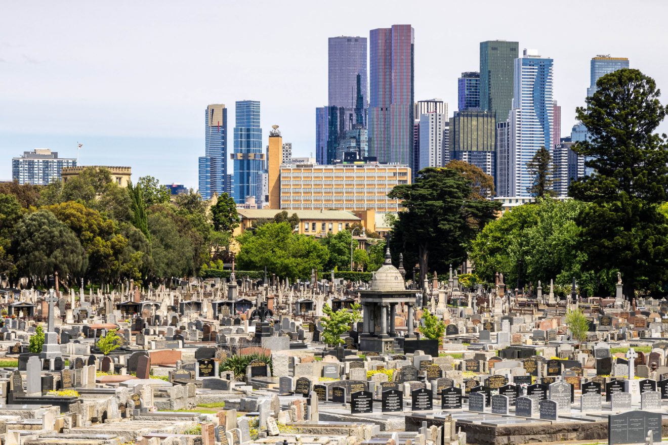 Wide shot of Melbourne General Cemetery with the city skyline in the background