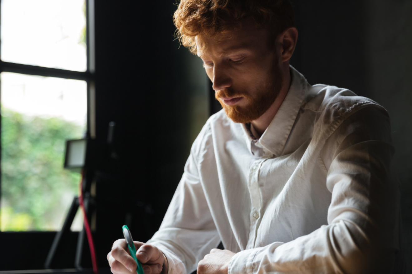 A man writing a moving eulogy