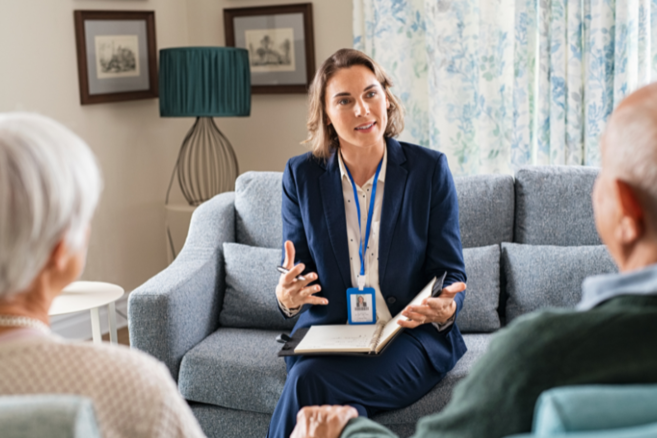 Funeral director discussing arrangements with an elderly couple