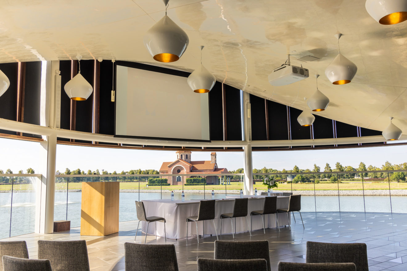 The Sanctuary at Bunurong Memorial Park, set up for a corporate function with projector, notepads and water.
