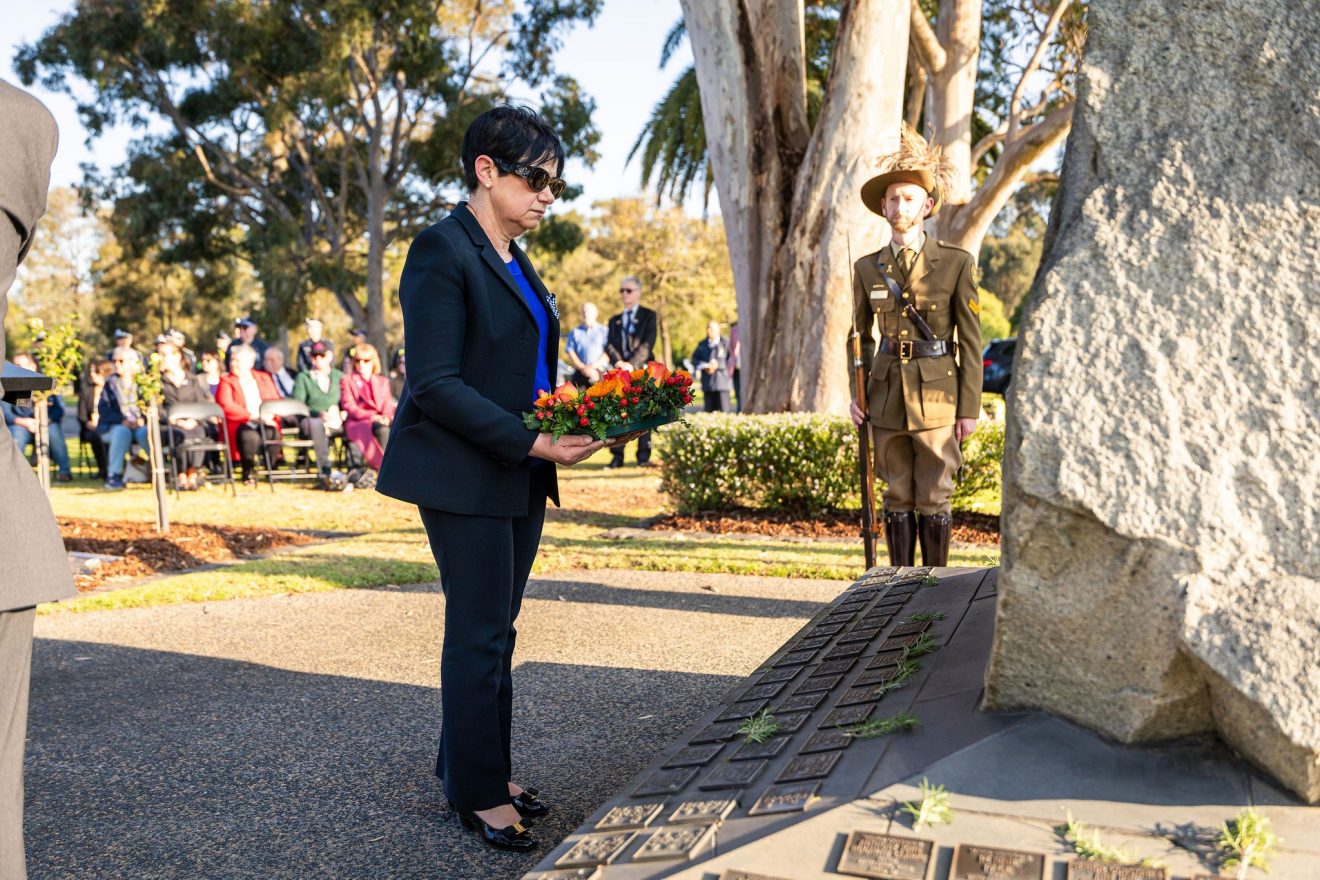 SMCT Trust Chair Vanda Fortunato is featured with a wreath at the Police Memorial.