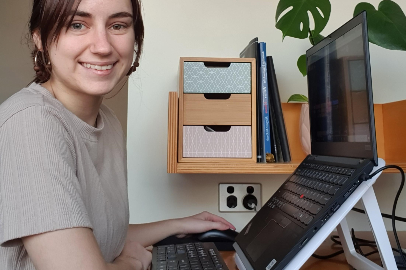 madison in front of her computer set up