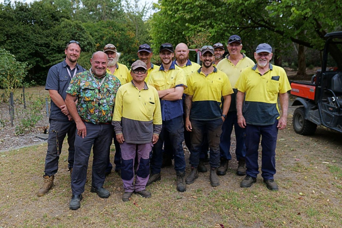 A group of outdoor team members standing together.