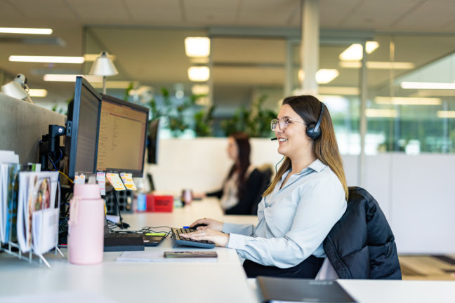 Customer Care Team Member on phone with customer